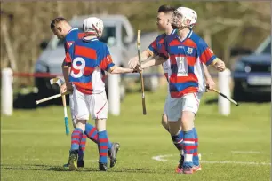  ?? Photograph: Neil Paterson. ?? Roddy Young, right, celebrates his late winning goal for Kingussie against Oban Camanachd.