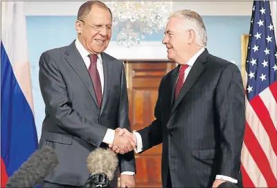  ?? Picture: GETTY IMAGES ?? UNEASY PEACE: Russian Foreign Minister Sergei Lavrov, left, and US Secretary of State Rex Tillerson greet in the Treaty Room before heading into meetings at the State Department in Washington yesterday