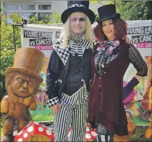  ??  ?? Pauline Reid Adamson and Charlie Adamson at an Alice in Wonderland tea party which raised funds for CLIC Sargent.