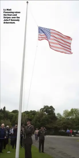  ??  ?? Lt. Niall Flemming raises the Stars and Stripes over the John F Kennedy Arboretum.