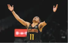  ?? John Bazemore / Associated Press ?? Atlanta point guard Trae Young reacts after hitting a basket in the second half of the Hawks’ win over the 76ers.