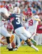  ??  ?? Alabama kicker Adam Griffith follows through on a field-goal attempt during Saturday’s game at Auburn.