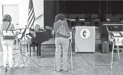  ??  ?? People vote at Trinity United Methodist Church on election day on Tuesday. BRAD VEST/THE COMMERCIAL APPEAL