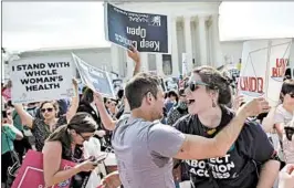  ?? MANDEL NGAN/GETTY-AFP 2016 ?? Activists celebrate a Supreme Court ruling against a Texas law that put limits on abortion clinics. Now some abortion rights proponents fear such decisions will be reversed.