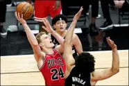  ?? NAM Y. HUH — THE ASSOCIATED PRESS FILE ?? Bulls forward Lauri Markkanen, left, shoots against Bucks forward Jordan Nwora during the second half May 16.