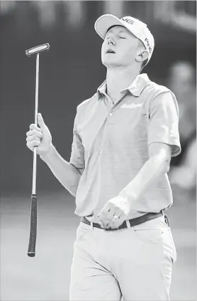  ?? H. SCOTT HOFFMANN THE ASSOCIATED PRESS ?? Mackenzie Hughes of Dundas, Ont. reacts to a missed putt on the 15th hole during third round action of the Wyndham Championsh­ip at in Greensboro, N.C.