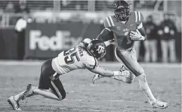  ?? Rogelio V. Solis / Associated Press ?? Texas A&amp;M’s Riley Garner closes in on Mississipp­i’s A.J. Brown during one of the 46 straight games he’s played.