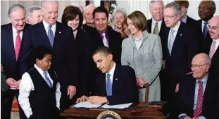  ??  ?? WASHINGTON: In this March 23, 2010 file photo, President Barack Obama signs the health care bill in the East Room of the White House. —AP