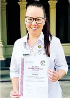  ?? ?? Emma Grigg with her award at Government House.