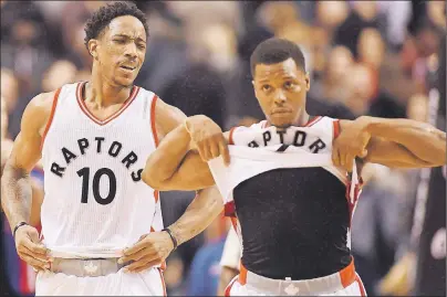  ?? CP PHOTO ?? Toronto Raptors guards DeMar DeRozan (left) and Kyle Lowry react after losing to the Detroit Pistons in NBA action in Toronto on Feb. 12.