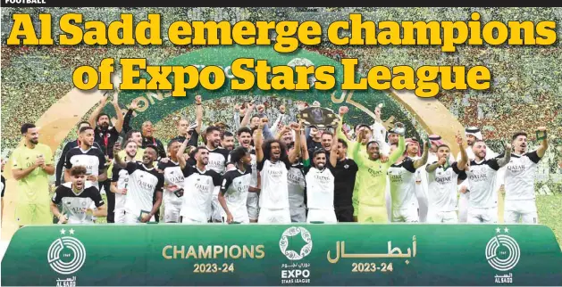  ?? ?? Al Sadd players celebrate with the winner’s Shield after clinching the Expo Stars League title at the Al Bayt Stadium in Al Khor yesterday.