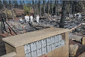  ?? Gina Ferazzi Los Angeles Times ?? RESIDENTS’ mailboxes stand intact as rescue teams from throughout Butte County survey the burned Ridgewood Mobile Home Park retirement community in search of human remains in Paradise in November.