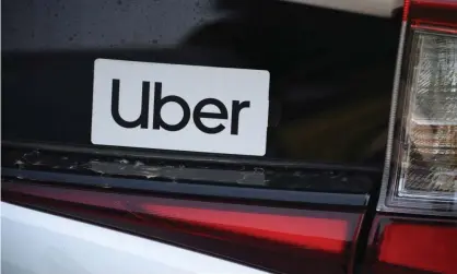  ?? Photograph: Robyn Beck/AFP/Getty Images ?? Uber reported a revenue of $2.9bn for the first quarter.