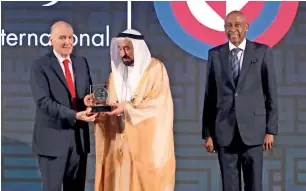  ?? Photo by M. Sajjad ?? Sheikh Sultan presents Sharjah Internatio­nal Award for Refugee Advocacy and Support to Dr Kamel Assaad Mohanna as Amin Awad, director, Mena, UN Refugee Agency, looks on. —