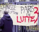  ??  ?? A banner reads ‘Paris 3 fights’ at the Paris 3 New Sorbonne University campus on Thursday