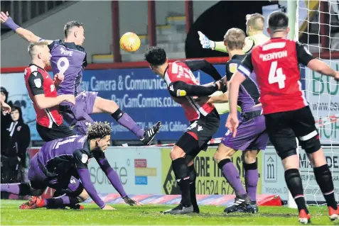  ??  ?? CLOSE CALL: Port Vale striker Tom Pope goes close during an attack on the Morecambe goal, but was unlucky on this occasion as his effort flies wide of target. Pictures: Gerard Austin