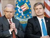  ?? ANDREW HARNIK/AP ?? Attorney General Jeff Sessions, left, praised FBI chief Chris Wray as an “American patriot” Thursday in Washington.