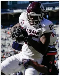  ?? (AP/Butch Dill) ?? Texas A&M tight end Jalen Wydermyer catches a pass over Auburn defensive back Jordyn Peters for a touchdown Saturday in Auburn, Ala. The No. 5 Aggies defeated Auburn 31-20.