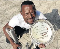  ?? / SANDILE NDLOVU ?? Lerato Chabangu with some of the awards he won during his glittering football career.