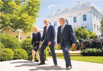  ?? ANDREW HARNIK AP ?? President Joe Biden, Swedish Prime Minister Magdalena Andersson (left) and Finnish President Sauli Niinisto leave the White House Rose Garden Thursday after speaking at a ceremony.