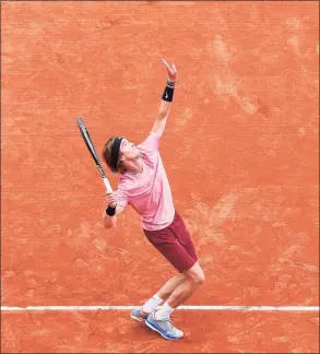  ?? Valery Hache / AFP via Getty Images ?? Andrey Rublev serves against Casper Ruud during the semifinals of the Monte-Carlo Masters in Monaco on Saturday.