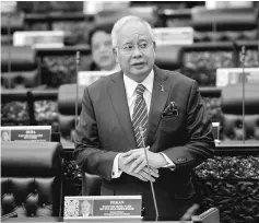  ??  ?? Najib replies to a question at the Dewan Rakyat sitting. — Bernama photo