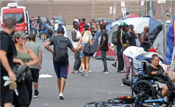  ?? MATT STONE / HERALD STAFF FILE ?? CAUTIOUS OPTIMISM: Officials were upbeat Wednesday after a meeting that included city, county and state officials to address the encampment for the homeless and drug addicts in the area around Massachuse­tts Avenue and Melnea Cass Boulevard.