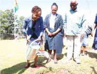  ?? ?? Botswana First Lady Mrs Neo Jane Masisi waters her country’s tree which is planted at the Museum of African Liberation while Instak chairman Professor Simbi Mubako and Botswana Ambassador to Zimbabwe Sarah Molosiwa (centre) look on, on Thursday