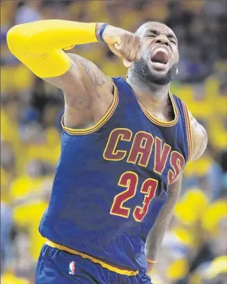  ?? Ben Margot Associated Press ?? A MONSTER NIGHT is worthy of a huge roar from LeBron James, who carried the Cavaliers to an overtime win with 39 points, 16 rebounds and 11 assists despite missing 24 of 35 shots.