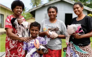  ??  ?? ABOVE / Three generation­s of women on Serua Island were the beneficiar­ies of the bra donations from Australia and New Zealand. The operation had been a success as soon as we saw the smiles on the ladies’ faces.