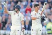  ?? AP ?? Alastair Cook (right) and Joe Root acknowledg­e the crowd.