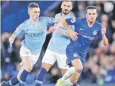  ??  ?? Manchester City’s Phil Foden (left) in action with Chelsea’s Pedro in this file photo. — Reuters photo