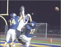  ?? GEORGE POHLY — THE MACOMB DAILY ?? Dylan Brooks (14) and Frank Boskovich of Fraser break up a pass intended for L’Anse Creuse receiver Brian Lewis during a MAC Blue game. L’Anse Creuse won 7-6.