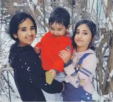  ?? Hussein family ?? Three of the Hussein children play in the snow in Edinburgh, their home for the past two years