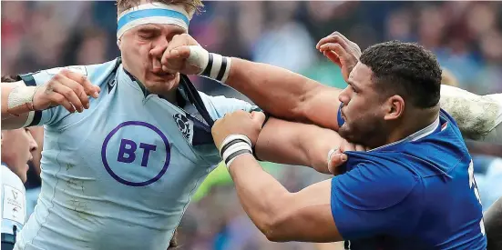  ?? GETTY IMAGES ?? Loser by a nose: Haouas thumps Scotland flanker Ritchie in the face, leading to a game-changing red card