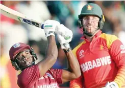  ??  ?? Half-centuries from Evin Lewis, Shai Hope and Marlon Samuels combined to outdo a fantastic century from Brendan Taylor (right), keeping West Indies well in the hunt for World Cup qualificat­ion at Harare Sports Club yesterday