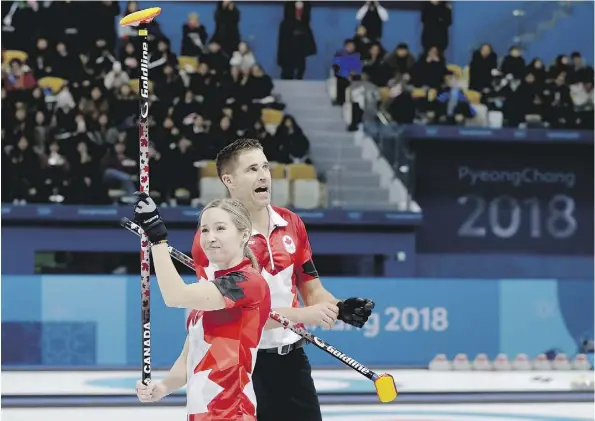  ?? NATACHA PISARENKO/THE ASSOCIATED PRESS ?? Canada’s Kaitlyn Lawes and John Morris celebrate winning their mixed doubles semifinal curling match against Norway’s Kristin Skaslien and Magnus Nedregotte­n on Sunday.