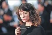  ?? Loic Venance AFP/Getty Images ?? ACTRESS Asia Argento says her partner, Anthony Bourdain, pushed for a settlement with her accuser.