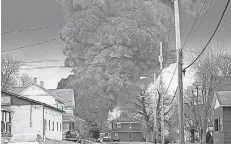  ?? GENE J. PUSKAR/ AP ?? A black plume rises over East Palestine, Ohio, after a controlled detonation of some derailed Norfolk and Southern trains.