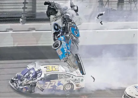  ??  ?? Ryan Newman (6) goes airborne after crashing into Corey LaJoie (32) during the Daytona 500 on Feb. 17. Newman, who suffered a head injury, will race Sunday when NASCAR resumes its season at Darlington Raceway.