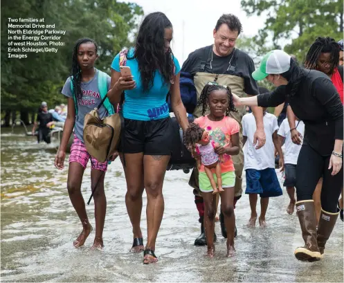  ?? Photo: Erich Schlegel/Getty Images ?? Two families at Memorial Drive and North Eldridge Parkway in the Energy Corridor of west Houston.