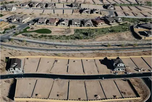  ?? Tribune News Service ?? New homes are under constructi­on at a housing developmen­t in Mesa, Arizona.