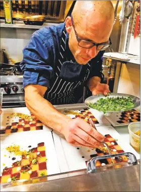  ?? Contribute­d photo ?? Carl Ciarcia III, owner of Bread & Water Restaurant at 51 Warwick St., Middletown, requires concentrat­ion to create his finely constructe­d dishes.