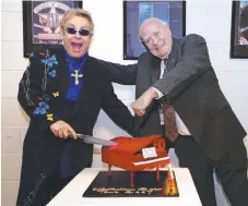  ??  ?? Michael Chugg and Elton John