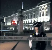  ?? LAUREN HURLEY/AP PHOTO ?? A police cordon outside Buckingham Palace where a man was arrested after an incident, in London, on Friday. A man armed with a knife was detained outside London’s Buckingham Palace Friday evening, and two police officers were injured while arresting...