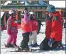  ?? AP ?? An instructor with young children in a ski lesson at Stowe Mountain Resort in Stowe, Vermont, in the United States.