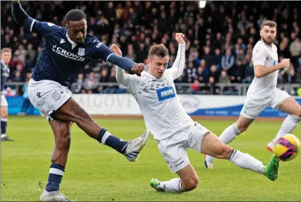  ?? ?? GOING CLOSE: Robinson tests the Ayr defence but the Dens hitman was to get his reward with Dundee’s second goal later on