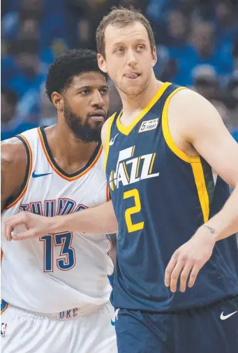  ??  ?? Australia’s Joe Ingles (right) defends against Oklahoma’s Paul George. Picture: GETTY IMAGES