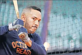  ?? [AP PHOTO/DAVID J. PHILLIP, FILE] ?? Houston Astros' Carlos Correa waits to bat during a baseball workout in Houston on Oct. 4, 2018.Andrew Miller