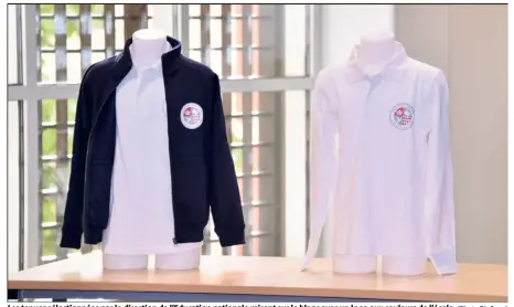  ?? (Photo Dir.Com.) ?? Les tenues sélectionn­ées par la direction de l’Education nationale misent sur le blanc avec un logo aux couleurs de l’école.